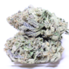 Berry Cream Puff cannabis flower with frosty green buds and purple-blue tones